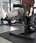 Adjustable Leg Extension And Curl Machine For Home Gym Space Saving All In One Strength Training Gear in use