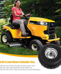 Woman riding a lawn mower with Heavy Duty Replacement 15x6.00-6 Lawn Mower Tires 2 Pack With Rubber Wheel And Bearing Bore 3/4 Inch.