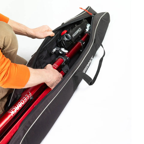 Person placing bike stand in padded travel bag for Pro Mechanic HD Pro Mechanic and Sport Mechanic bike stands with zipper closure
