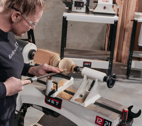 Woodworker using 12 By 21 Inch Variable Speed Woodworking Lathe With 1 HP 115V 1 Phase Three RPM Ranges 60 to 900 110 to 1800 220 to 3600 Ratchet Belt Tension System Big DRO Recessed Power Switch
