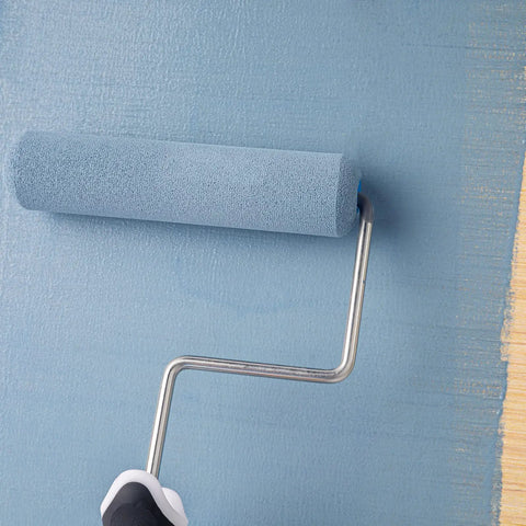 Six Inch High Density Foam Paint Roller Kit With Tray And Liners Nine Pack Mini Rollers painting a blue wall for smooth finish