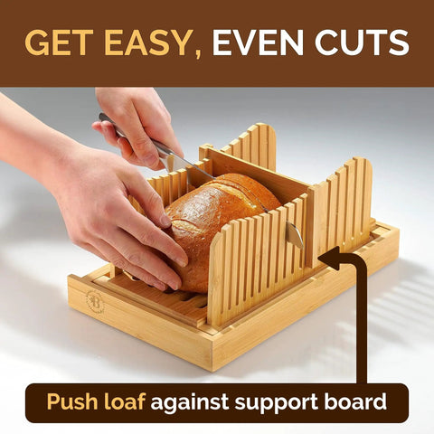 Person slicing bread using Dope Adjustable Bamboo Bread Slicer With Foldable Slicing Guide And Crumb Tray A Must Have.