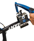 Hands using Oversized Adjustable Saw Guide For Bikes SG 7.2 Built Beefy For Aero Shaped Seat Masts And Posts Up To 3.5 Inches Deep