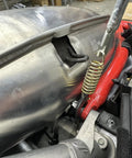 Push Industries 102.302 exhaust spring removal tool, steel coil handle mounted on motorcycle exhaust