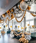 Metallic Chrome 6 Inch Quick Link Balloons Set Of 60 For Easy Link Balloon Garland Wall Arch displayed at an event