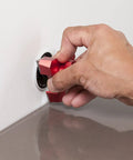Hand using Heavy Duty Tungsten Carbide Scribing Tool Imperial Metric Gauge on laminate for precise cuts.