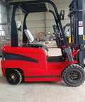 Heavy Duty Electric Forklift High Capacity Pallet Lifter With Steel Mast Anti Rust Finish For Harbor Docks And Rough Job Sites side view showing rugged tires and operator seat