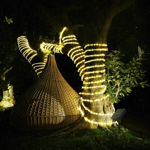Long 33 Feet Solar Rope Lights With 100 LEDs, Copper Fairy String Tube Lights, decorating tree outdoors at night