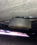 Tesla Model 3 Y S X Lifting Jack Pads 4 Pack With Mesh Carry Bag shown under car, solid rubber pad at jacking point for maintenance.