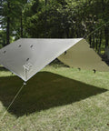 Rainfly Tarp Hammock Shelter Ultralight Waterproof Canopy set up in a grassy area with forest background, OD green color