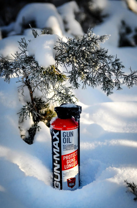 12 Ounce All In One Gun Oil And Cleaner Heavy Duty Lubricant And Rust Protectant For Pistols And Rifles in snowy environment