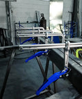 Heavy Duty Top Shelf 12 Inch Lever Clamp Packing 1100 Pounds Of Iron Grip Hold With Spindle Free Ratcheting Action And Ergonomic Handle For Fast Track Shop Projects, multiple clamps on a metal frame.