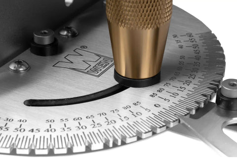 Close-up of a Heavy Duty Miter Gauge with 27 Positive Stops for Table Saws, showing steel and brass construction.