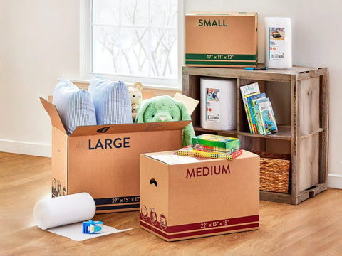 Room with Sturdy 22x13x15 Shipping Boxes for Moving, Packing, Storage and Mail, brown kraft cardboard, containing pillows