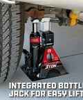 Powerbuilt 3-Ton all-in-one hydraulic bottle jack with integrated jackstand installed under vehicle near wheel
