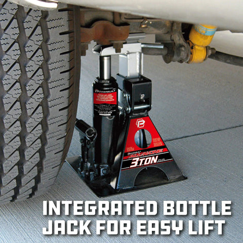Powerbuilt 3-Ton all-in-one hydraulic bottle jack with integrated jackstand installed under vehicle near wheel