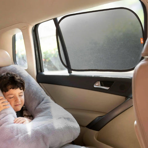 Child sleeping in car beside 2 Pack Car Window Sun Shades For Kids, UPF 50+ UV Block, 14.2 By 21.3 Inches, Static Cling Privacy Covers