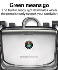 Hamilton Beach Panini Press And Sandwich Maker With Electric Indoor Grill showing green light indicator for cooking readiness.