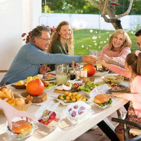 Family enjoying outdoor meal with 100 Count Clear Thickened Plastic Food Containers With Lids Clamshell Takeout Boxes