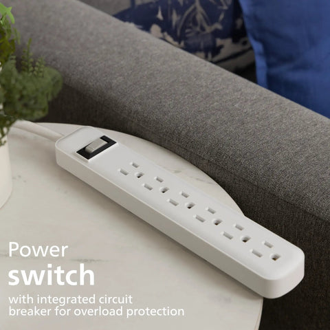 Six Outlet Surge Protector Power Strip With A 2 Ft Cord, 450 Joules Surge Protection, shown on a corner table in home setting