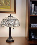 Vintage Tiffany Style Stained Glass Table Lamp 22 Inch Tall With White And Gray Mahogany Floral Shade For Bedside Living Room Bedroom Decor Handmade Gift LED Compatible Amora Lighting on wooden desk with bookshelf in background.
