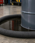 Heavy Duty Universal Absorbent Socks 12 Plus Pack Spill Containment Tubes around a barrel catching liquid spills in a garage.
