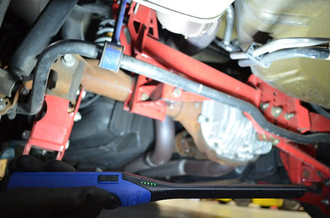 Mechanic using Beast Mode Slim LED Work Light With 650 Lumen COB Main Beam And 120 Lumen Top Flashlight under car chassis