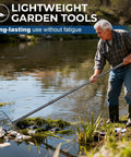 Man using Heavy Duty 16 Inch Metal Garden Rake With 56 Inch Handle And 11 Steel Tines for debris removal at water's edge
