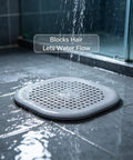 ACDANC 2 Pack Drain Cover Hair Catcher Pad, Silicone Tube Trap on shower floor filtering hair while allowing water flow.