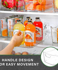 Person holding a Straight Up Sturdy 12 Pack Clear Plastic Storage Bins With Handles, showcasing easy movement in a fridge.