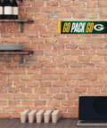 Premium Green Bay Packers Metal Street Sign Wall Art Featuring Bold Team Graphics And Rust Resistant Finish Ideal For Man Cave Bedroom Or Home Office Decor displayed on a brick wall.