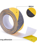 Non Slip Tape Heavy Duty Outdoor Waterproof Safety Tape For Stairs Treads Ramps And Skateboards With Ultra Strong Adhesive Grip Yellow And Black 2 Inch Wide 33 Foot Long Great For Wet Surfaces To Prevent Slips And Falls showing the tape roll and texture