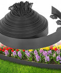 Roll of Easy Install Landscape Edging Border Kit with 75 stakes shown against garden bed of tulips and grass