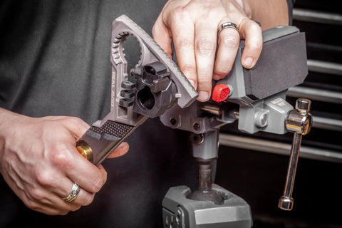 360 Degree Swivel Bench Vise With 5 Inch Jaw Width For Gun Cleaning And Maintenance High Torque Up To 100 Ft Lb Ideal For Woodworking DIY Projects Firearm DIY And Versatile Clamping in use during gun maintenance