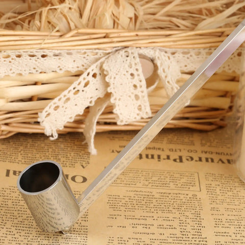 Bad Boy Stainless Steel Candle Snuffer With Super Long Handle And Slick Silver Plating on wooden surface, close-up shot.