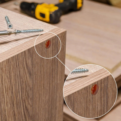 Close-up of Wine Red Wood Hole Plugs Set With 120 Pieces In Four Sizes Three Sixteenths Five Sixteenths Three Eighths And Half Inch installed on wood furniture, highlighting clean finish and installation.