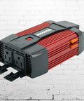 Heavy Duty 900W Peak Power Inverter Converts Dc 12V To Ac 110V with dual outlets and cooling fan for car and RV use.