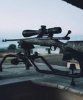 Stinger Adjustable Ambidextrous Rifle Shooting Rest With Lightweight Build For Rock Solid Stability Outdoors And Range No Wobble Elevation System Cam Over Front Rest Locks Steel Tube Frame holding a rifle on a wooden table outdoors.