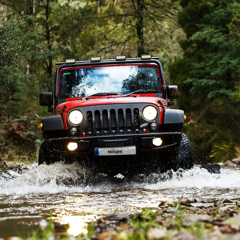 Red Jeep crossing stream with Two Pack 6.5 Inch 120W LED Spot And Flood Combo Driving Lights With 16AWG Harness mounted on roof.