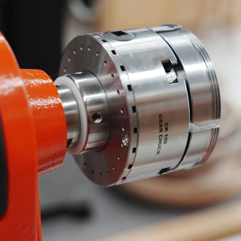 Pack Of Six Slick Anti Lock Spindle Washers Tailored For 1-1/4 Inch Woodlathe Threads mounted on a gear chuck with spindle.