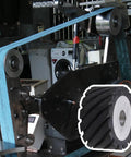 Top Shelf Aluminum Core Rubber Contact Wheel For Belt Sanders And Polisher Machines Featuring Serrated Grip Surface Rock Steady mounted on a sander.