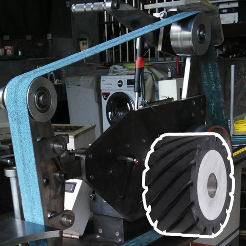 Top Shelf Aluminum Core Rubber Contact Wheel For Belt Sanders And Polisher Machines Featuring Serrated Grip Surface Rock Steady mounted on a sander.
