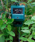 3 In 1 Soil Moisture Light And PH Tester for Indoor Outdoor Gardens Lawn Farm Greenhouse, no batteries, green casing in use among plants.