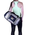 Woman carrying Breathable Mesh Gear Bag Built Heavy Duty For Gym Beach Swim Scuba Sports Dive And Outdoor Use Your Go To Organizer