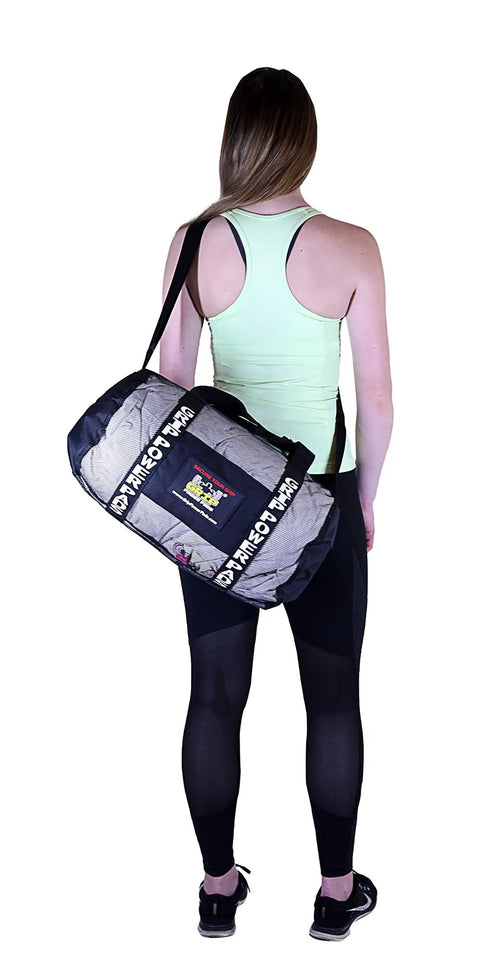 Woman carrying Breathable Mesh Gear Bag Built Heavy Duty For Gym Beach Swim Scuba Sports Dive And Outdoor Use Your Go To Organizer