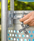 Hand using TwinKey Multifunctional Spanner Kit With Magnetic Eight Arm Two By Four Way Spider Keys on metal control cabinet