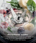 Heavy Duty Personal Blender Featuring 900W Push To Blend Motor And Pro Extractor Blades Crushing Ice For Nutrient Dense Smoothies Including Three Grab And Go 20 Oz Serveware Cups In Classic Silver - close-up of Pro Extractor Blades in action.