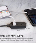 Three Outlet Power Strip With Eighteen Inch Braided Extension Cord Grounded Three Prong Adapter And Low Profile Flat Plug ETL Listed Black Dark Heather Finish For A Clean No Fuss Close To Wall Setup, shown powering a phone and notebook on a marble surface