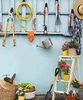 Garden tools and hose organized on wall with ladder using heavy duty garage hooks six pack two point eight inch U shaped hanger.