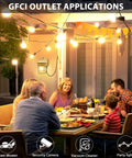 Family dining outdoors with Durable Dusk To Dawn Outdoor Porch Light With GFCI Outlet And Two Receptacles illuminating patio